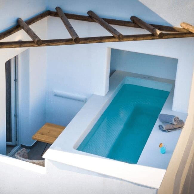 Outdoor plunge pool under a wooden pergola on an Executive Suite terrace, Emerald Collection Suites
