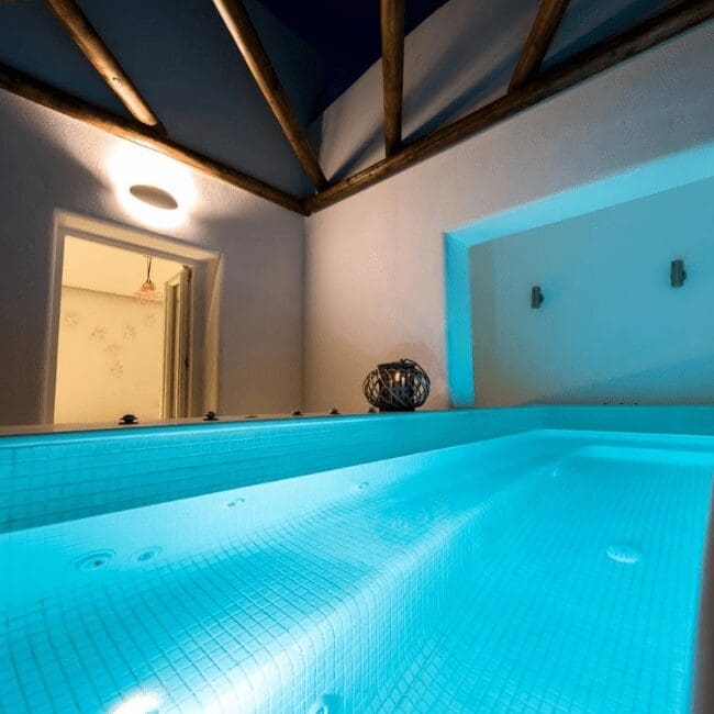 Private indoor hot tub with mood lighting in a suite at Emerald Collection Suites, Santorini